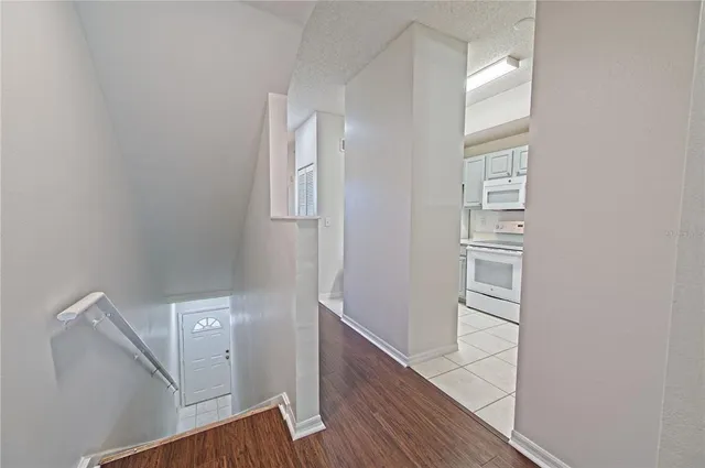 a spacious bathroom with a granite countertop sink a mirror and a shower