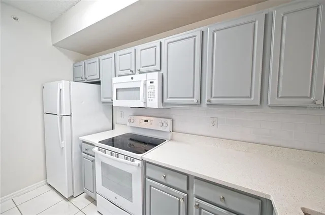 a bathroom with a toilet and a bath tub