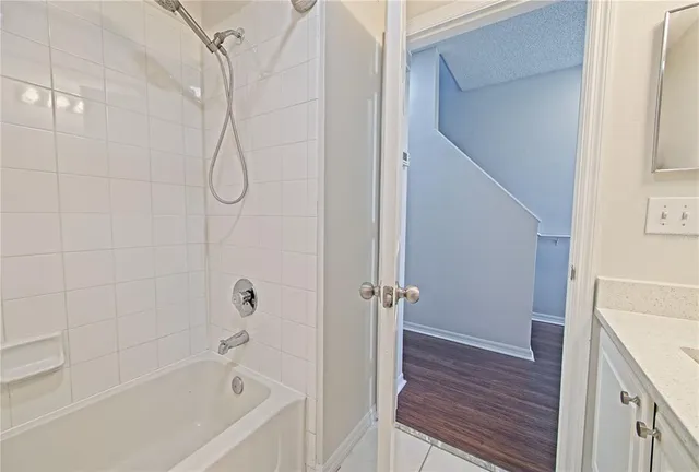 a room with gym equipment and a view of living room