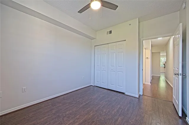 a living room with furniture a dining table and a large window