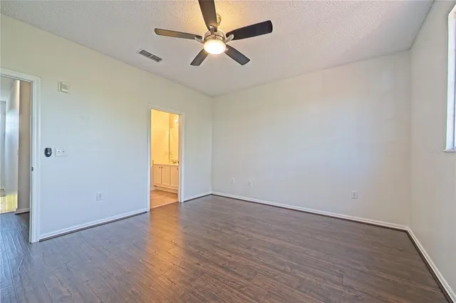 a backyard of a house with outdoor seating