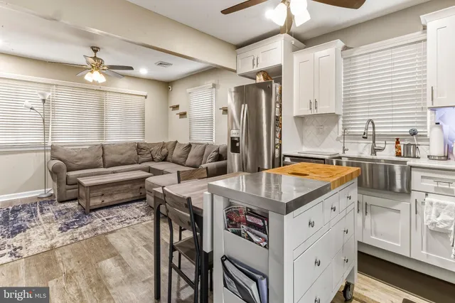 a kitchen with stainless steel appliances granite countertop a stove and a refrigerator