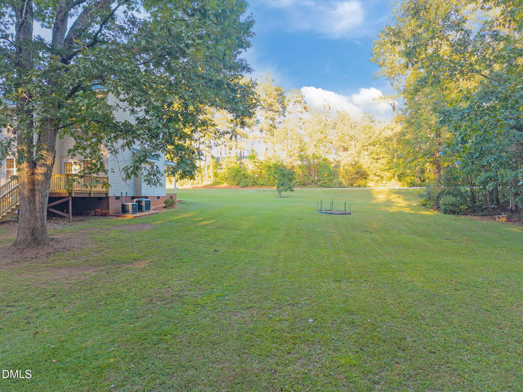505 Vinson Road Clayton, NC 27527 - Photo 1 of 31 a view of yard with grass and trees