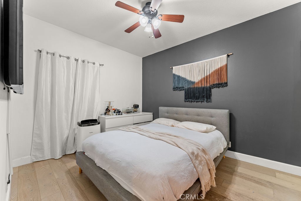 1145 Roswell Avenue, Unit 8A Long Beach, CA 90804 - Photo 12 of 35 a bedroom with bed and window