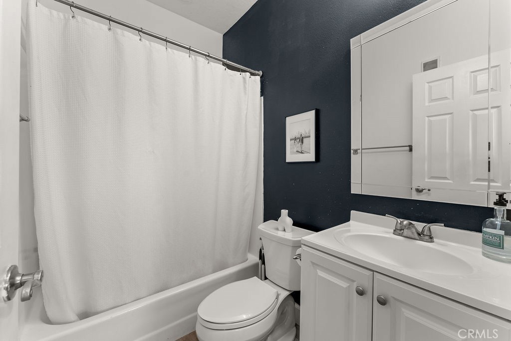 1145 Roswell Avenue, Unit 8A Long Beach, CA 90804 - Photo 16 of 35 a bathroom with a sink a toilet and shower