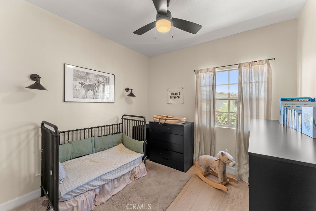 1145 Roswell Avenue, Unit 8A Long Beach, CA 90804 - Photo 17 of 35 a bedroom with furniture and a window