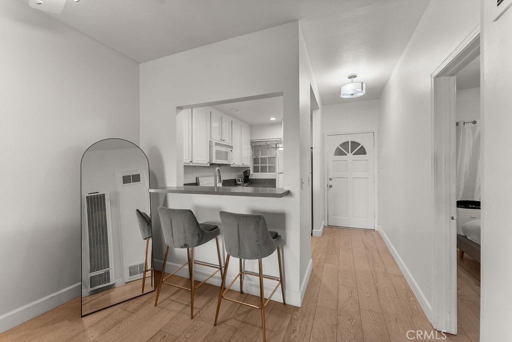 1145 Roswell Avenue, Unit 8A Long Beach, CA 90804 - Photo 6 of 35 a kitchen with stainless steel appliances granite countertop a refrigerator and a stove top oven