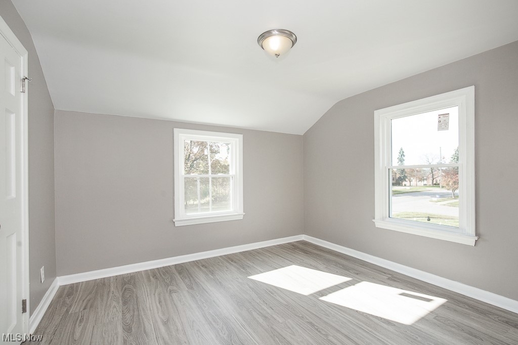 19109 Libby Road Maple Heights, OH 44137 - Photo 12 of 32 Bonus room with lofted ceiling and light hardwood / wood-style flooring