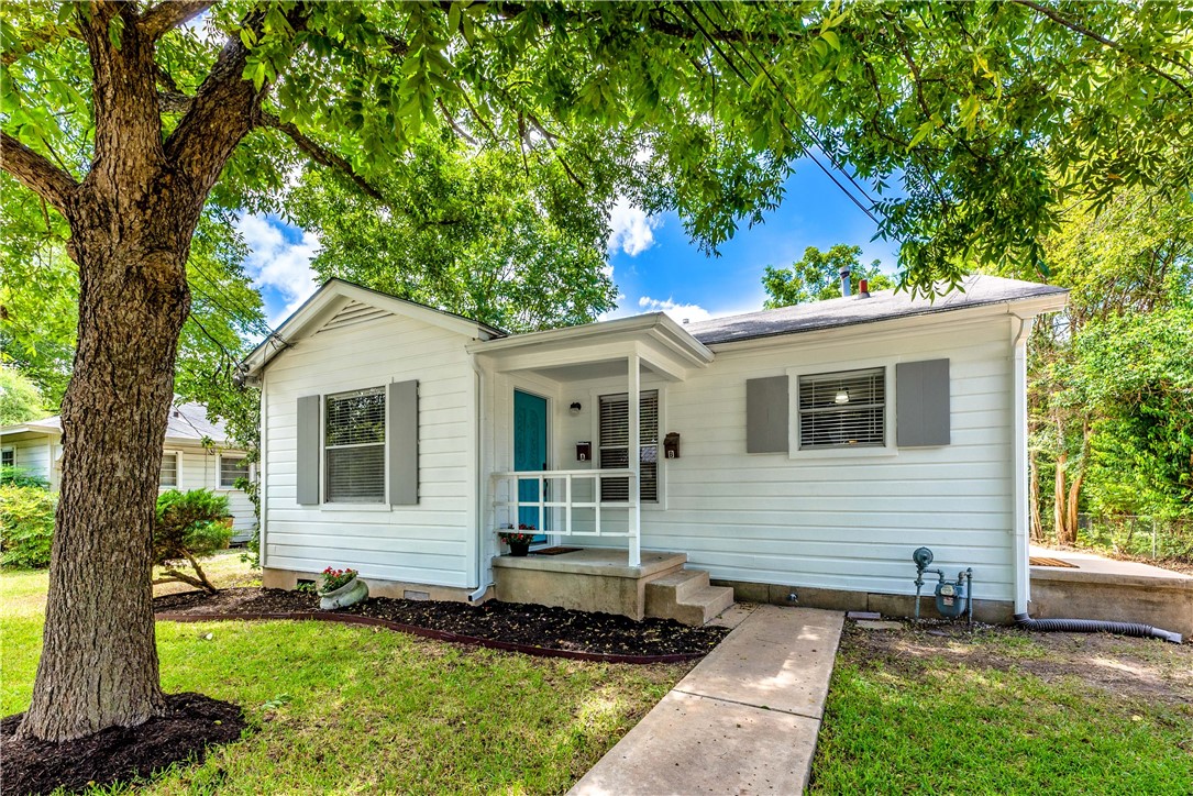 1413 Alguno Road Austin, TX 78757 - Photo 1 of 1 a front view of a house with a yard