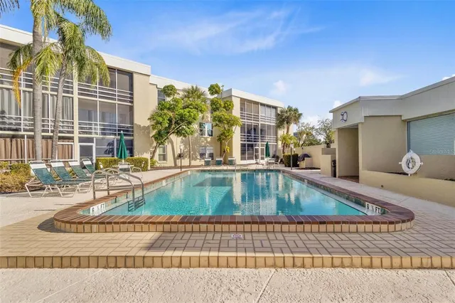 a view of a swimming pool with a lounge chairs