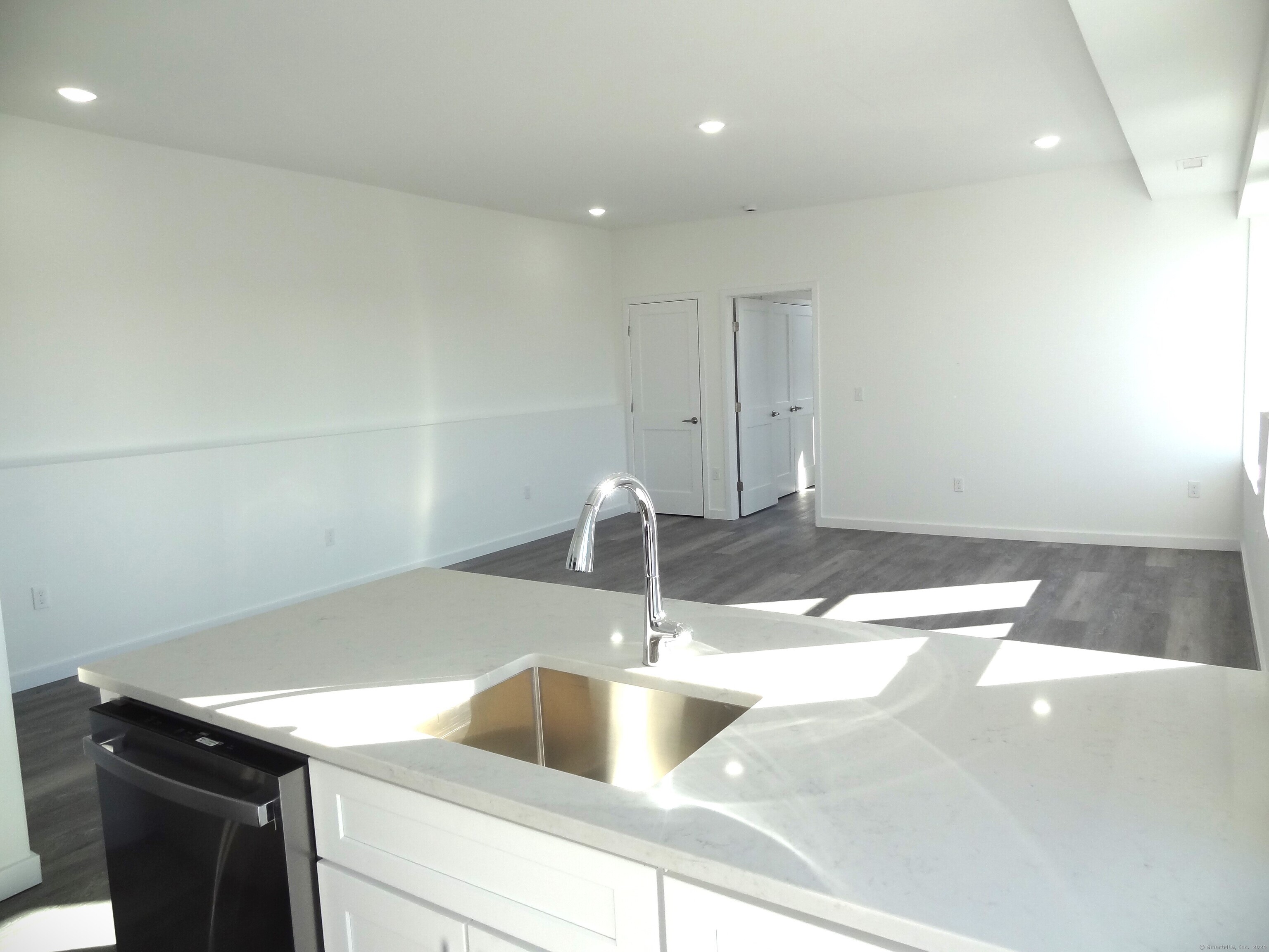 2806 Fairfield Avenue, Unit 307 Bridgeport, CT 06605 - Photo 5 of 24 a kitchen with a sink and cabinets