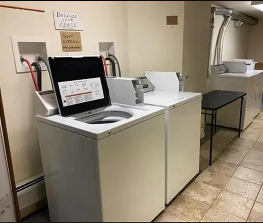 a utility room with washer and dryer