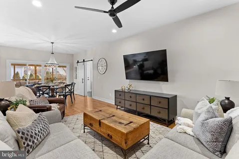 a spacious bedroom with a bed and a couch