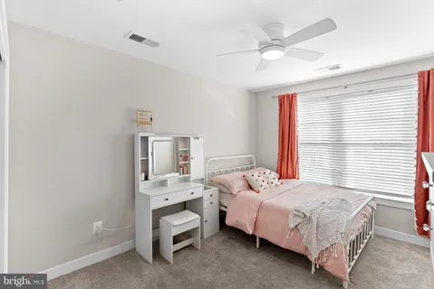 a bathroom with a double vanity sink a mirror and shower