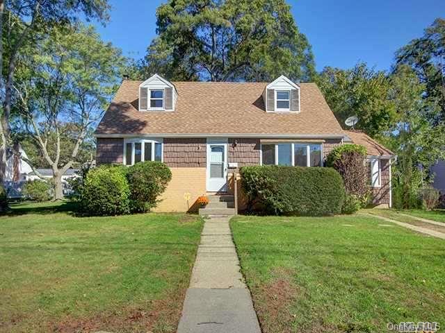 93 Brookes Road North Babylon, NY 11703 - Photo 1 of 1 a front view of a house with yard