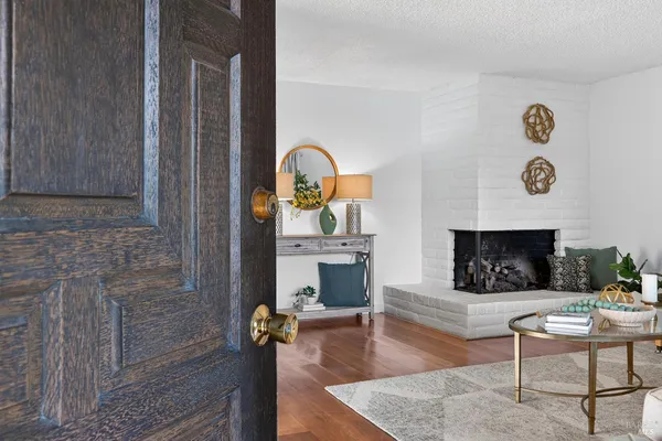 a living room with furniture and a fireplace