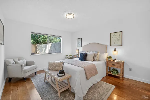 a bedroom with a bed and a couch