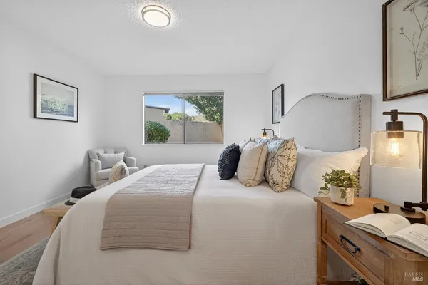 a bedroom with a bed and window