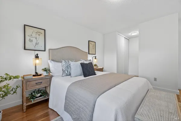 a bathroom with a sink vanity granite and toilet