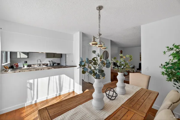 a view of living room with furniture and flowers