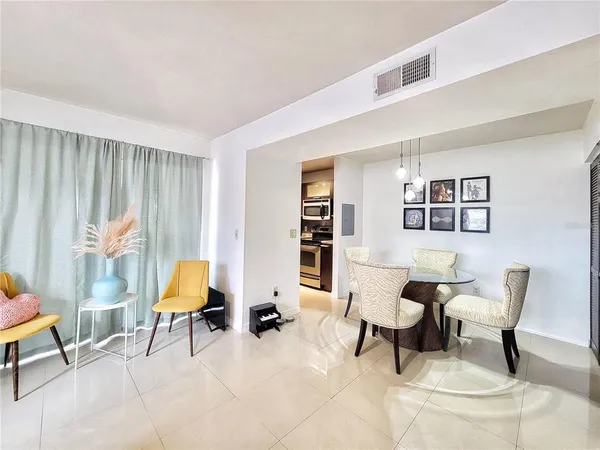 a living room with furniture and a lamp