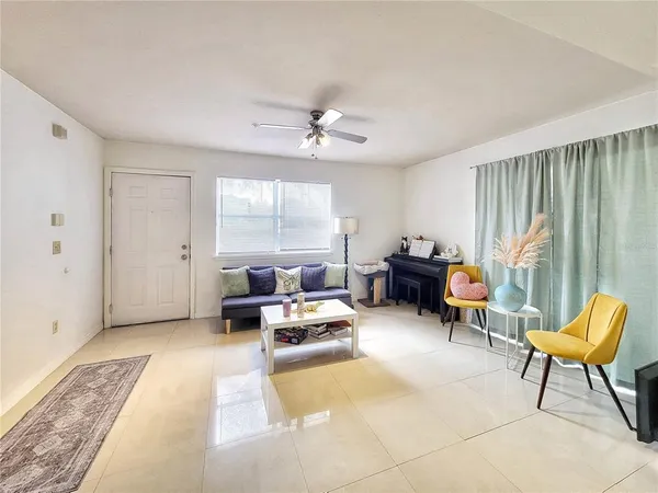 a living room with furniture and a large window