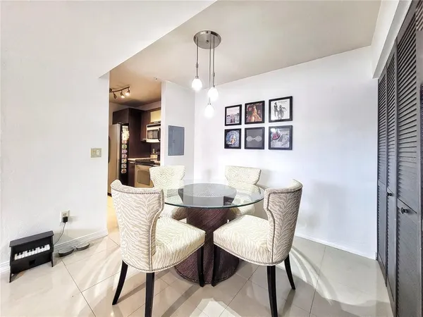 a dining room with furniture and window