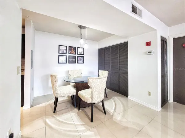 a view of a dining room with furniture and window