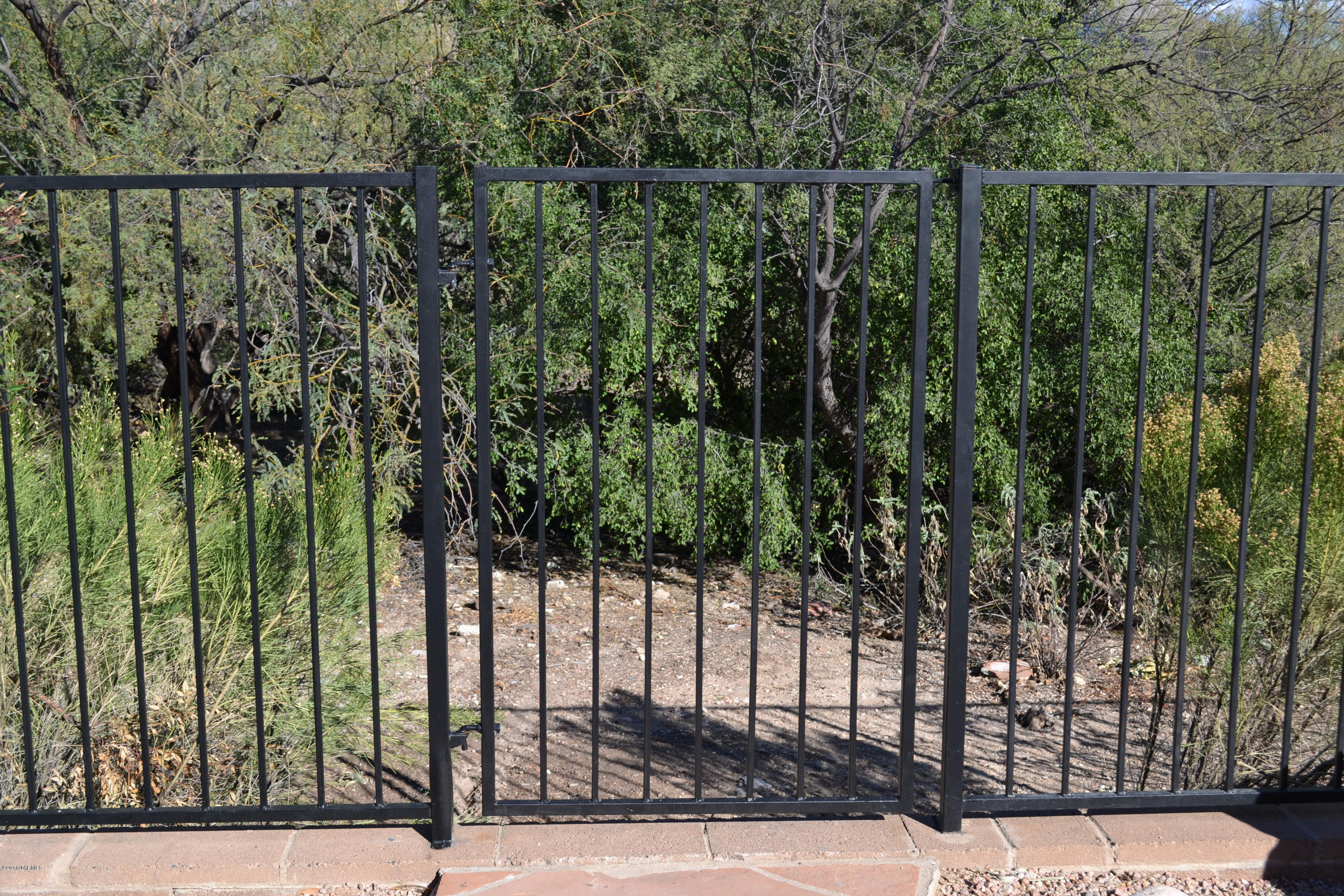5640 North Cherokee Ridge Road Tucson, AZ 85750 - Photo 32 of 39 a view of a balcony with a floor to ceiling window