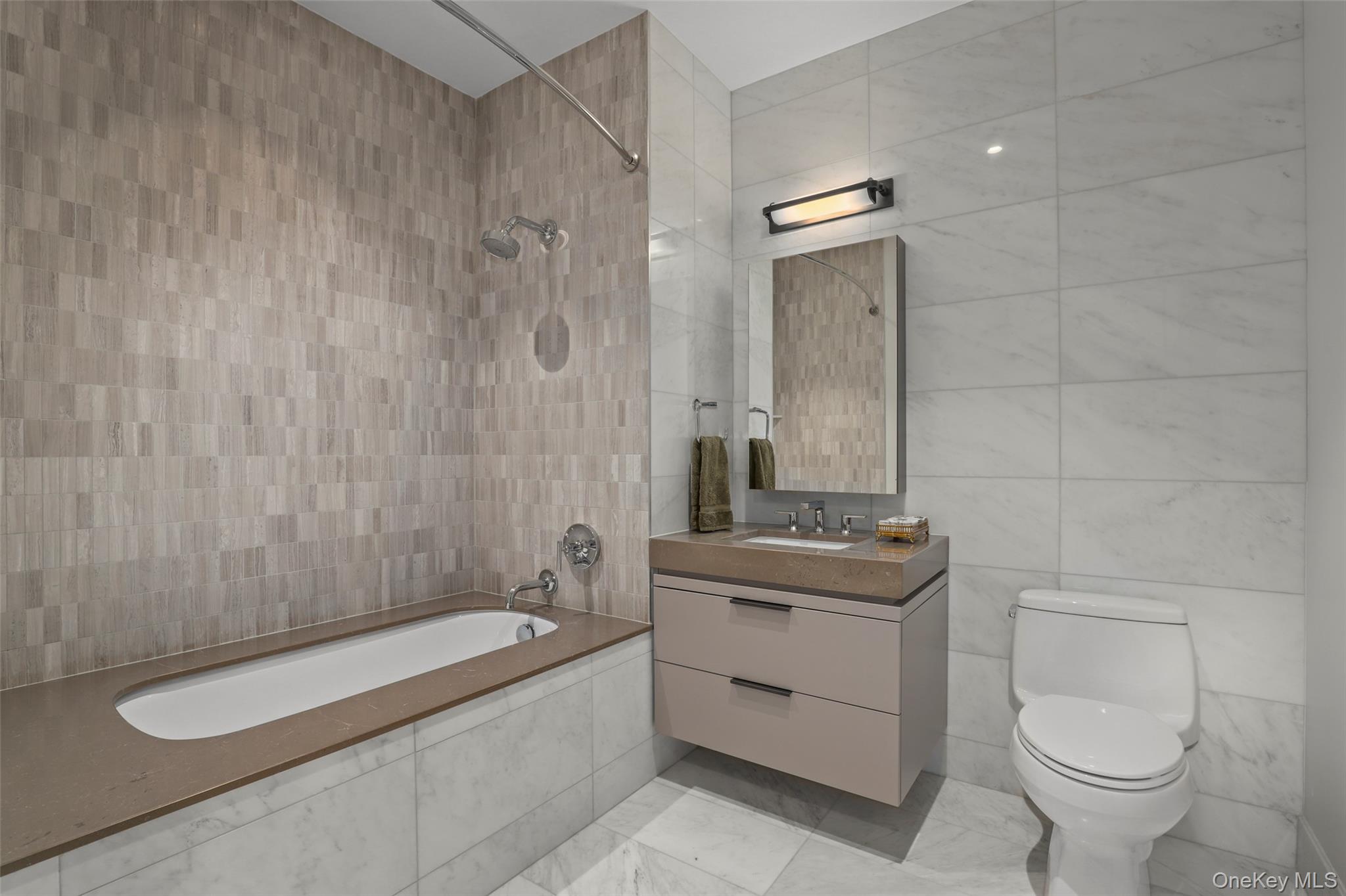 120 Old Post Road, Unit PHB301 Rye, NY 10580 - Photo 22 of 30 a bathroom with a granite countertop sink a toilet and mirror