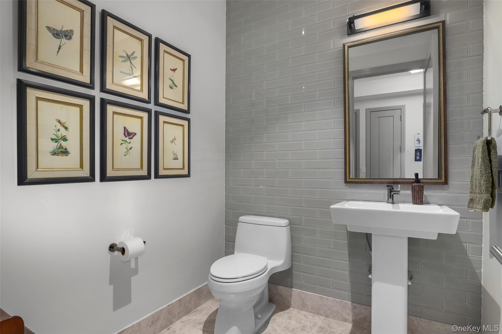 120 Old Post Road, Unit PHB301 Rye, NY 10580 - Photo 23 of 30 a bathroom with a toilet sink and mirror