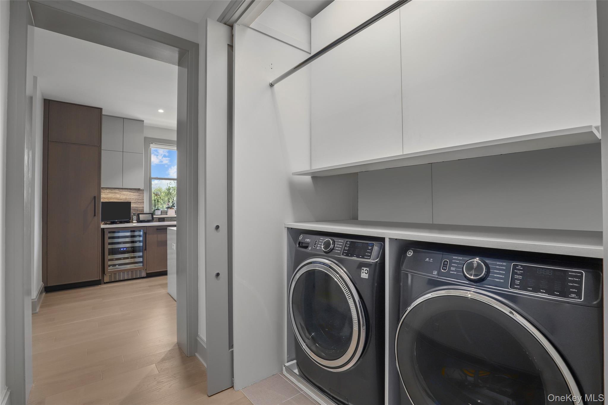 120 Old Post Road, Unit PHB301 Rye, NY 10580 - Photo 24 of 30 a view of a hallway with washer and dryer