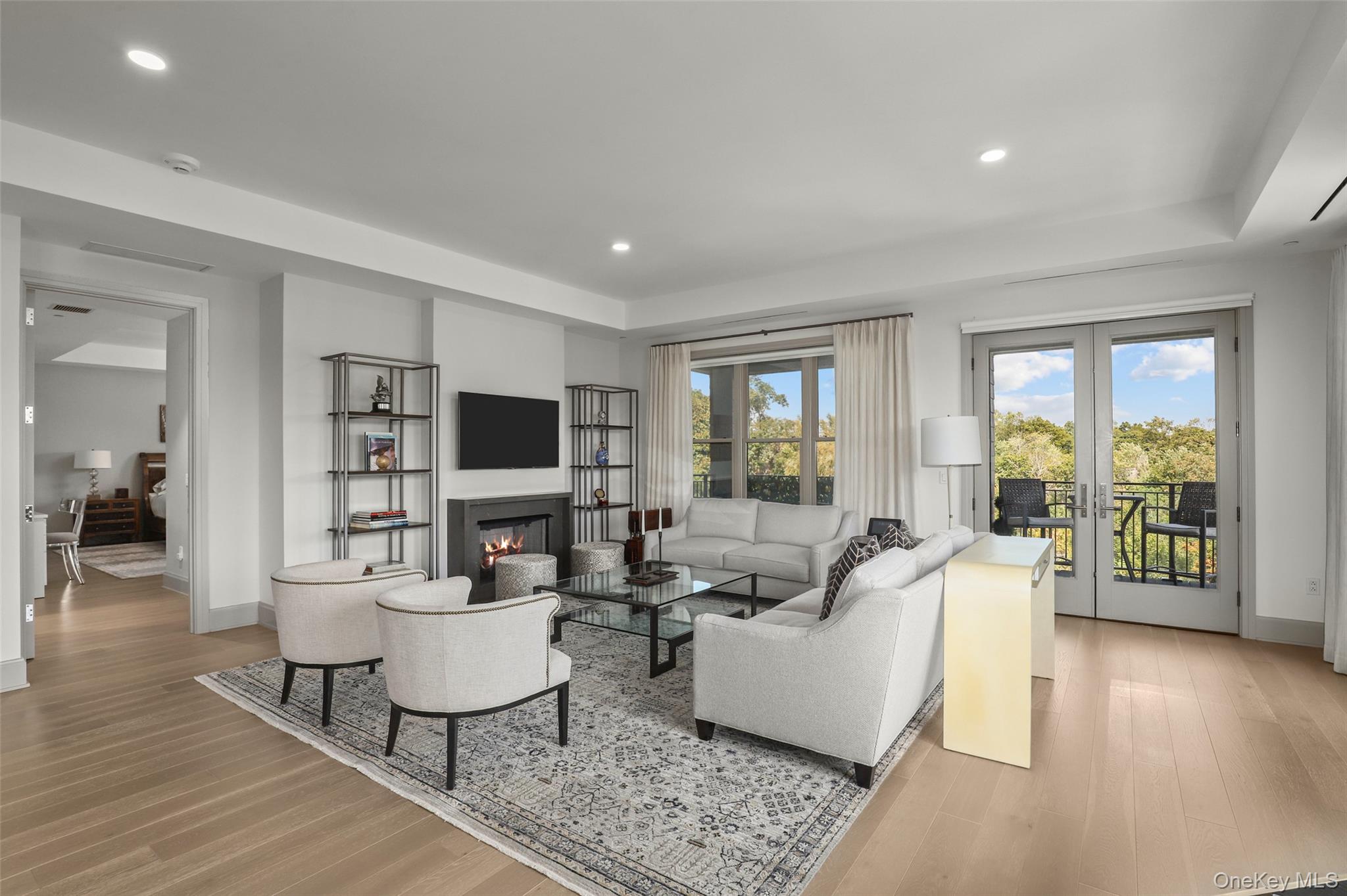 120 Old Post Road, Unit PHB301 Rye, NY 10580 - Photo 7 of 30 a living room with fireplace furniture and a flat screen tv