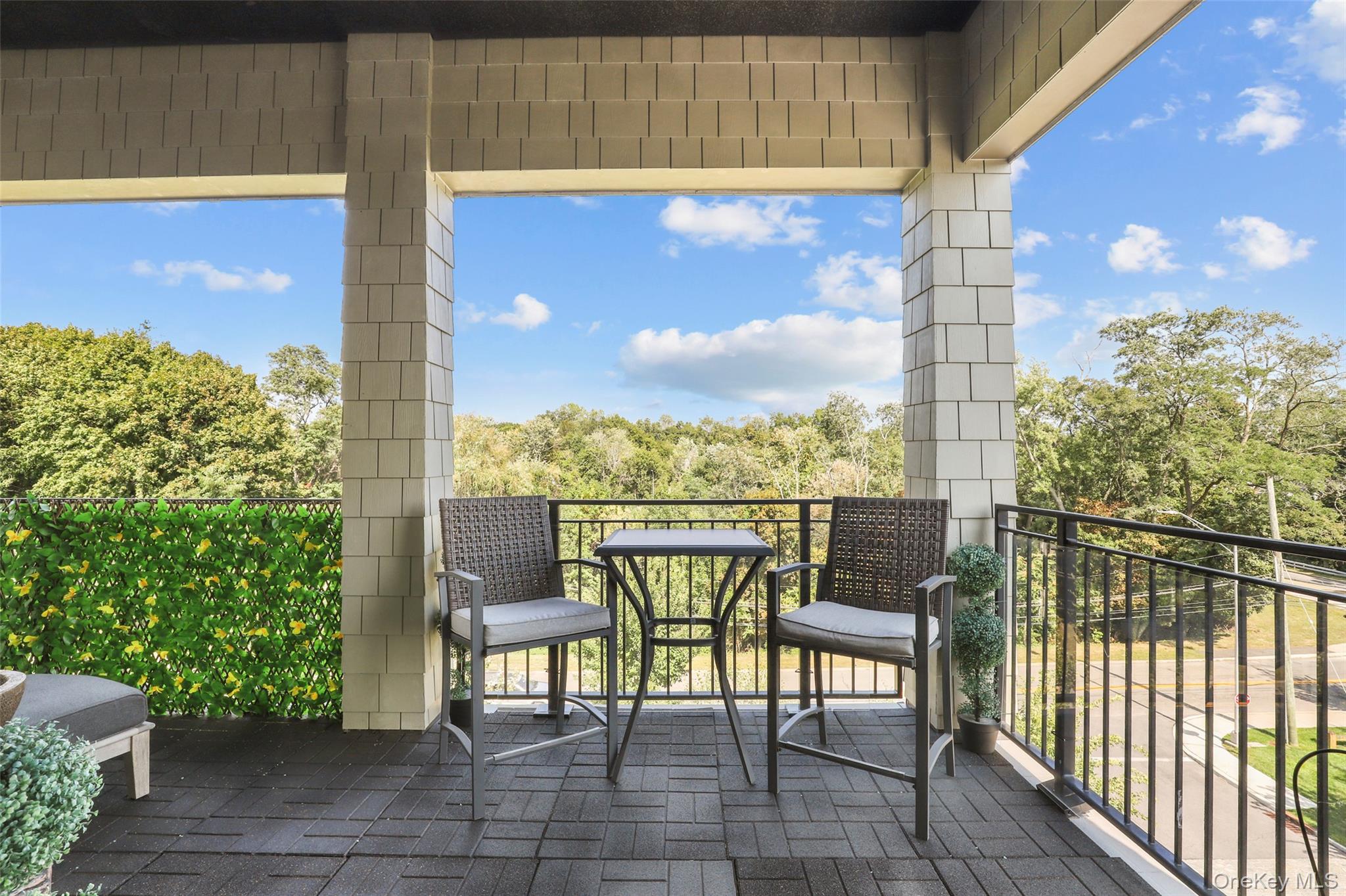 120 Old Post Road, Unit PHB301 Rye, NY 10580 - Photo 10 of 30 a view of a balcony with chairs