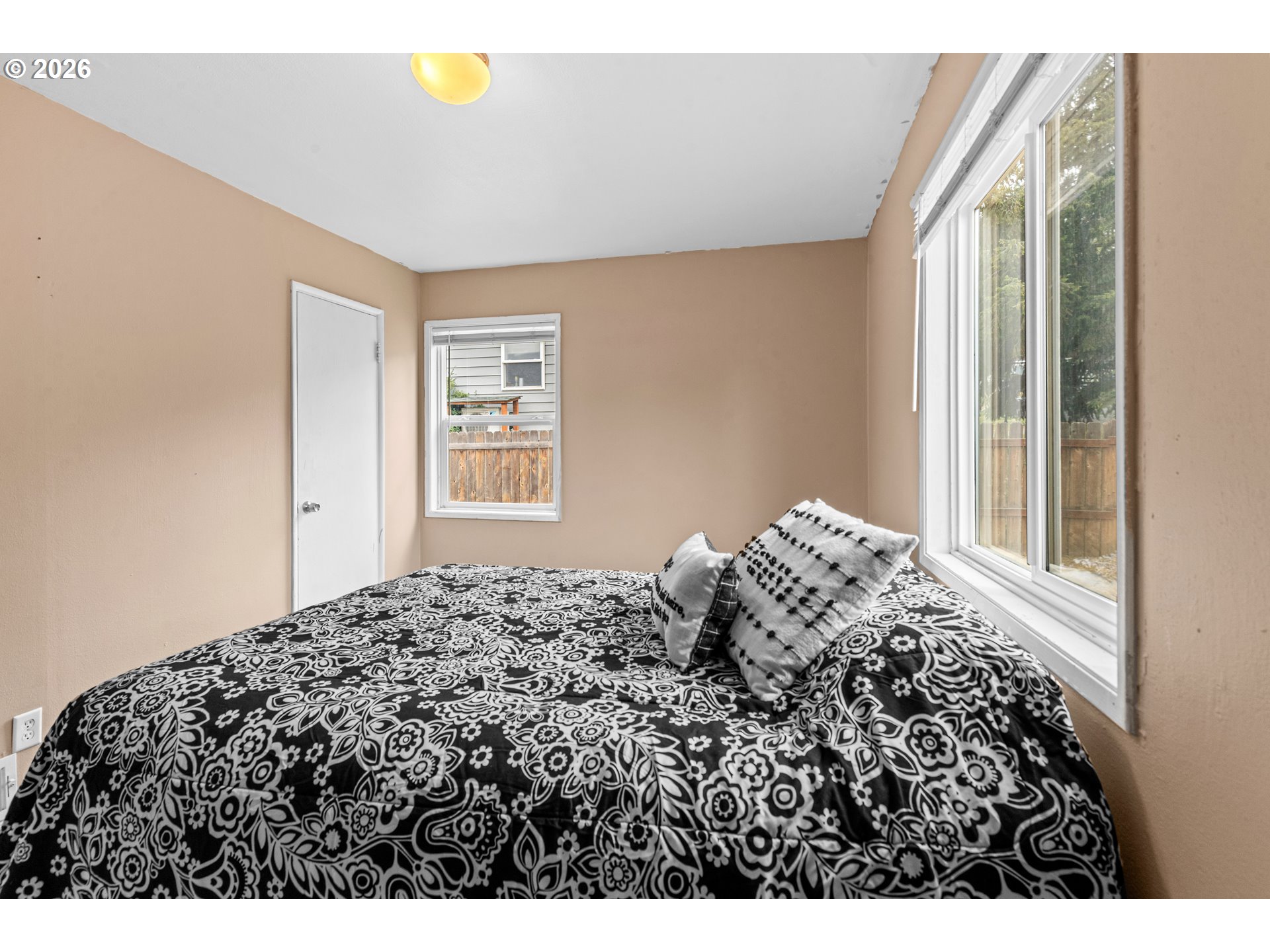 3009 Southwest Isaac Avenue Pendleton, OR 97801 - Photo 18 of 28 a bed sitting in a bedroom next to a window