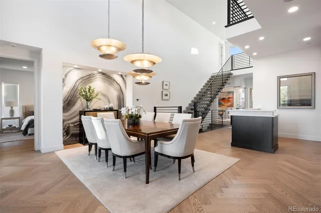an open kitchen with dining table and chairs