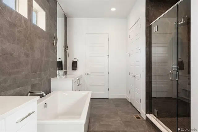 a bathroom with a bathtub and a sink
