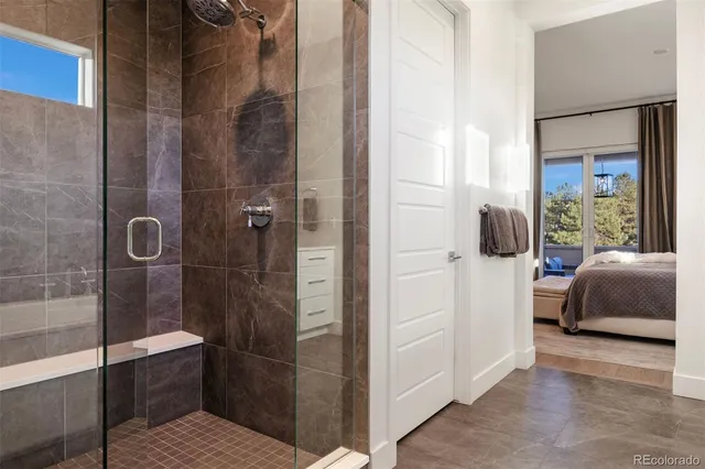 a bathroom with a tub and shower