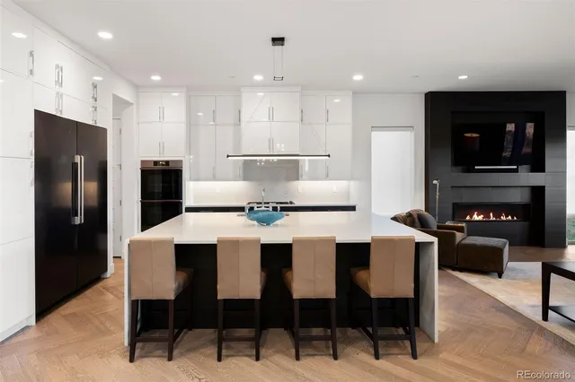 a large kitchen with a table and chairs