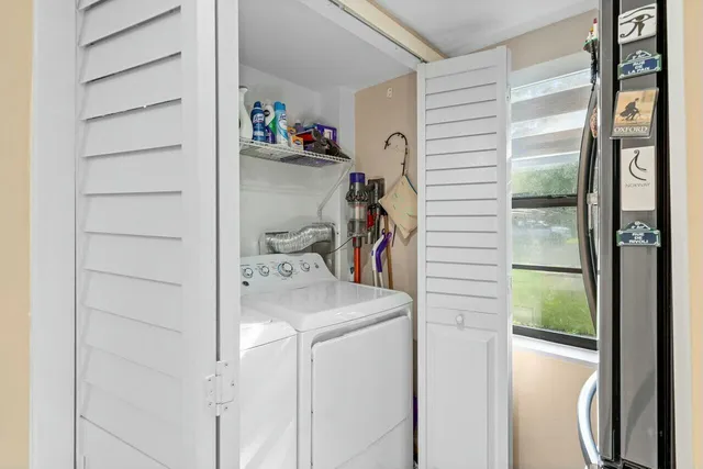 a utility room with dryer and washer