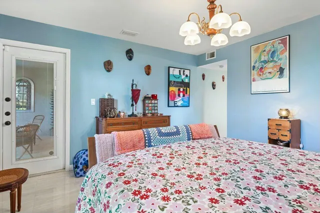 a bedroom with a bed and dresser