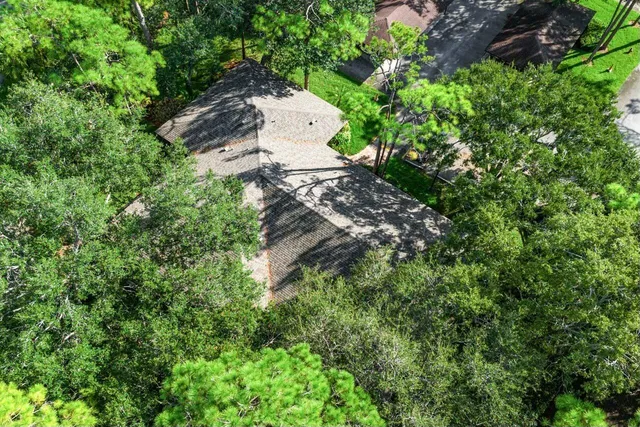 a backyard of a house with a yard and outdoor seating