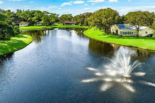 a view of a lake with a house in the background