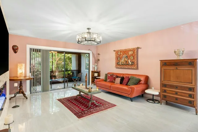 a living room with furniture and a rug