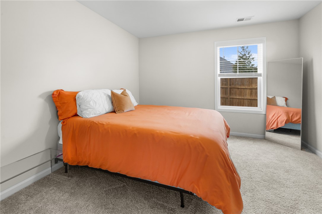 235 Pendleton Road, Unit Q1 Clemson, SC 29631 - Photo 13 of 30 This cozy bedroom features soft carpeting and a window offering natural light.