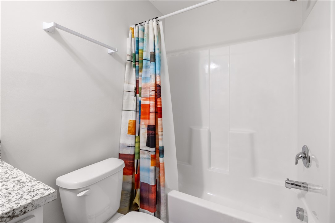 235 Pendleton Road, Unit Q1 Clemson, SC 29631 - Photo 16 of 30 This bathroom features a sleek bathtub and a toilet, perfect for daily routines.