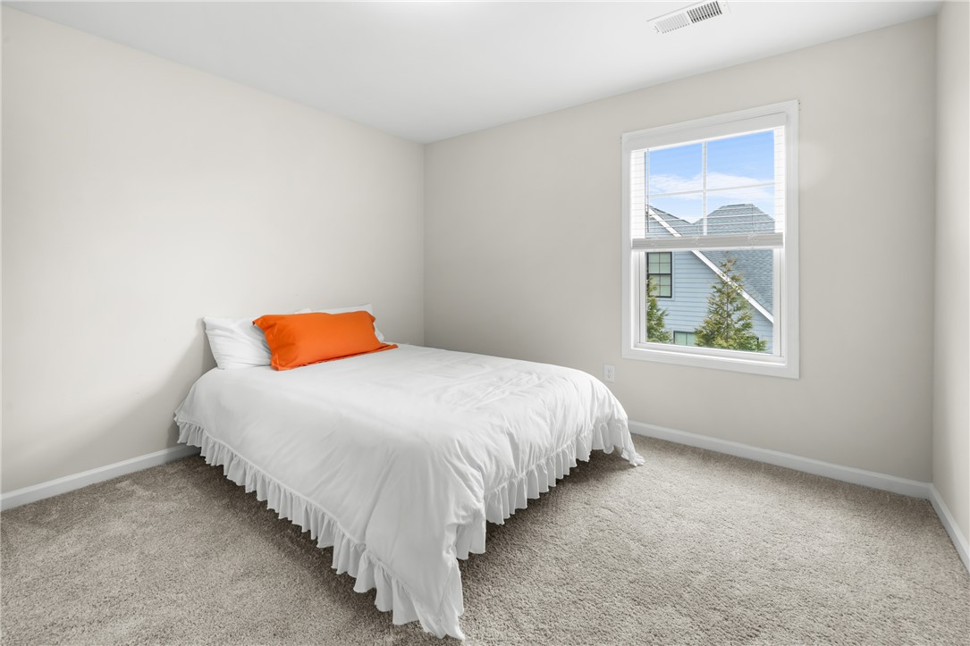 235 Pendleton Road, Unit Q1 Clemson, SC 29631 - Photo 20 of 30 This cozy bedroom features plush carpeting and a bright window overlooking the neighborhood.