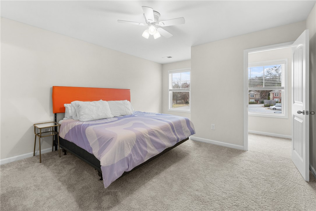 235 Pendleton Road, Unit Q1 Clemson, SC 29631 - Photo 22 of 30 This airy bedroom offers a comfortable retreat with soft carpet and natural light.
