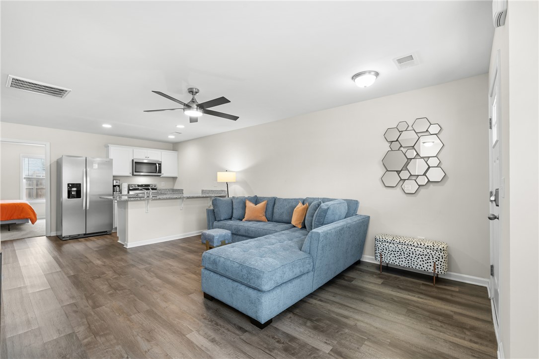 235 Pendleton Road, Unit Q1 Clemson, SC 29631 - Photo 5 of 30 This living area seamlessly connects to the kitchen, creating an inviting and functional space.
