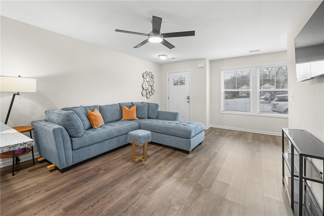 235 Pendleton Road, Unit Q1 Clemson, SC 29631 - Photo 7 of 30 This bright living area features abundant natural light and durable flooring, perfect for comfortable living.